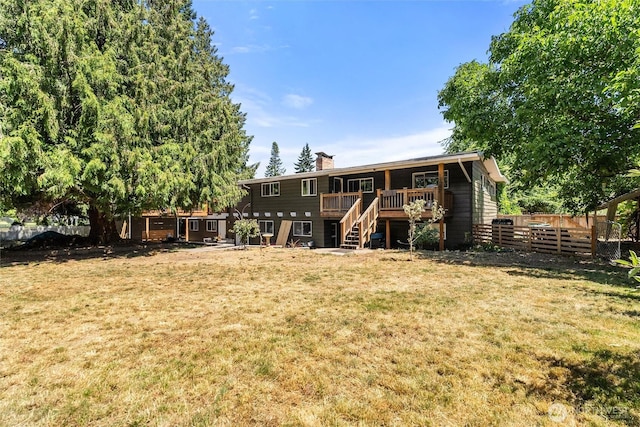 22616 88th Ave W, Edmonds, WA 98026 - back of property featuring stairs, a chimney, a fenced backyard, and a deck