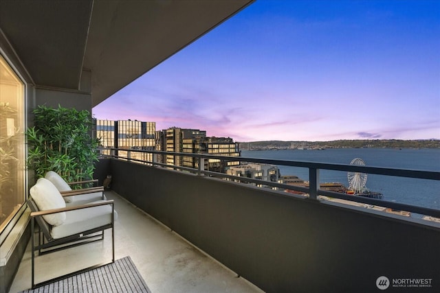 1415 2nd Ave NE Unit 1801, Seattle, WA 98101 - balcony at dusk featuring a water view