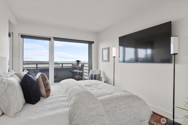 1415 2nd Ave NE Unit 1801, Seattle, WA 98101 - bedroom featuring wood finished floors and baseboards