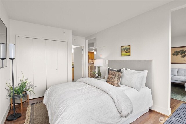 1415 2nd Ave NE Unit 1801, Seattle, WA 98101 - bedroom featuring a closet and wood finished floors