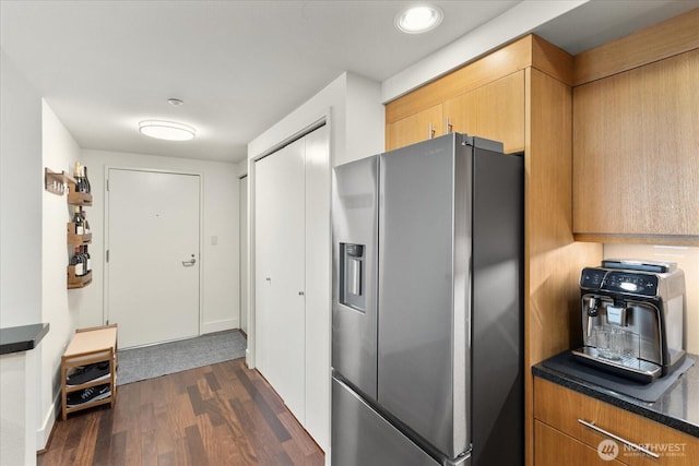 1415 2nd Ave NE Unit 1801, Seattle, WA 98101 - kitchen with stainless steel fridge, dark wood-type flooring, and dark countertops