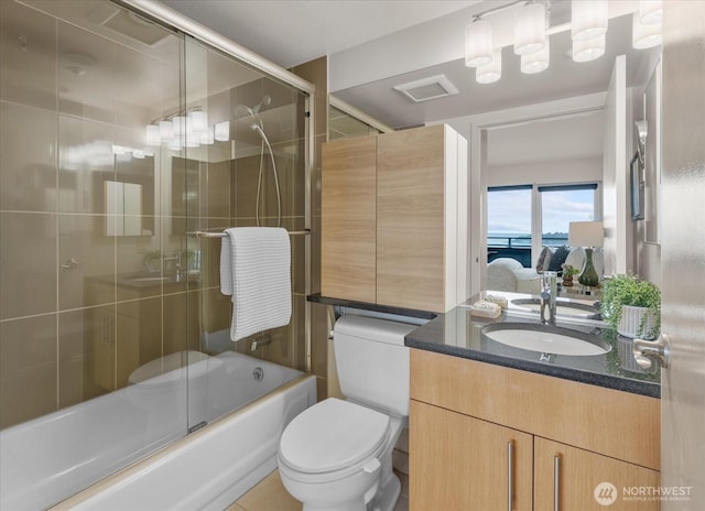 1415 2nd Ave NE Unit 1801, Seattle, WA 98101 - bathroom with vanity and bath / shower combo with glass door