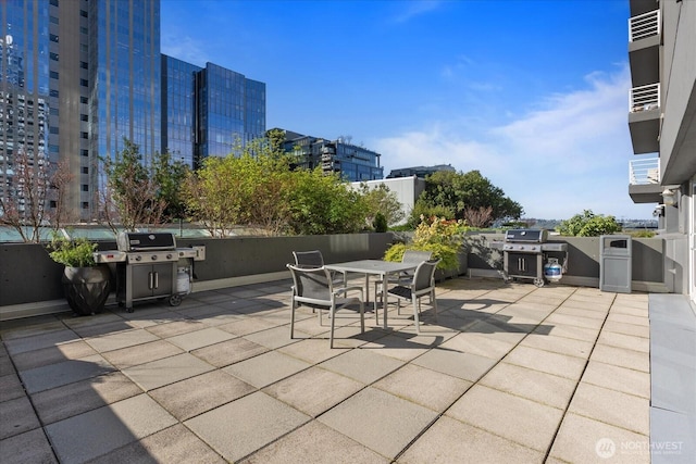 1415 2nd Ave NE Unit 1801, Seattle, WA 98101 - view of patio / terrace with a grill and outdoor dining area