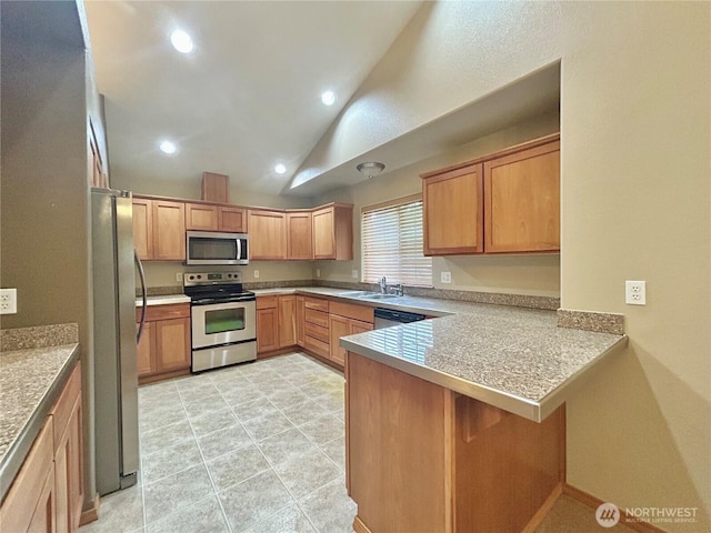 4544 Durham St SE, Lacey, WA 98503 - kitchen with stainless steel appliances, a peninsula, lofted ceiling, a kitchen bar, and recessed lighting