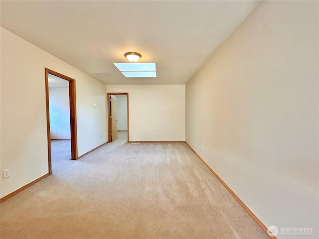 4544 Durham St SE, Lacey, WA 98503 - spare room featuring a skylight and light carpet
