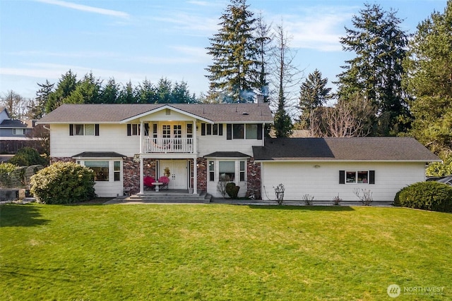 7707 42nd Ave E, Tacoma, WA 98443 - back of property with a balcony, a lawn, and a chimney