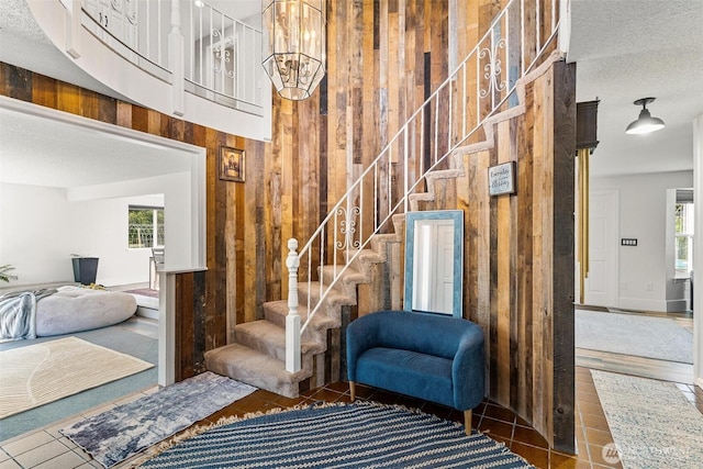 7707 42nd Ave E, Tacoma, WA 98443 - stairs with wood walls, healthy amount of natural light, and a high ceiling