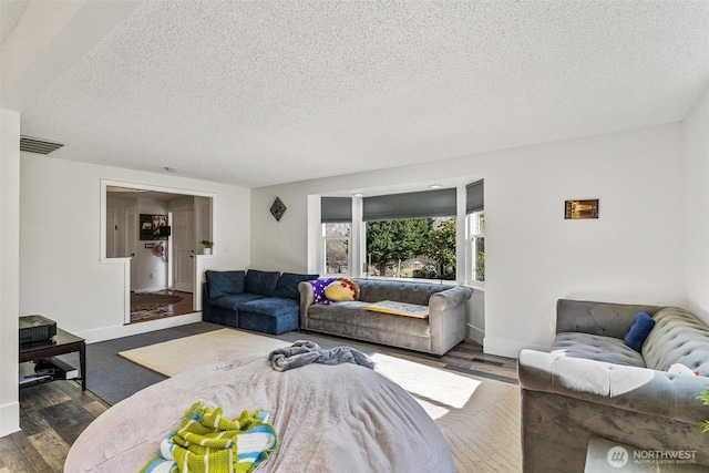 7707 42nd Ave E, Tacoma, WA 98443 - living area with a textured ceiling and wood finished floors