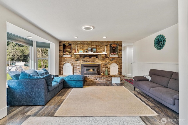7707 42nd Ave E, Tacoma, WA 98443 - living room with a wainscoted wall, wood finished floors, and a fireplace