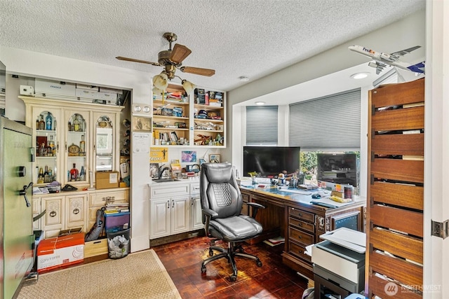 7707 42nd Ave E, Tacoma, WA 98443 - office featuring ceiling fan, a textured ceiling, and built in desk