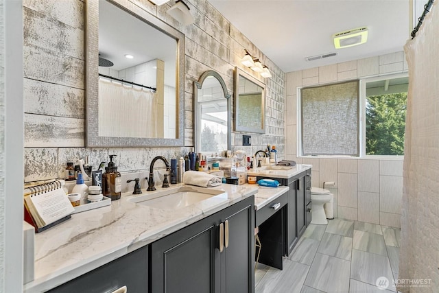 7707 42nd Ave E, Tacoma, WA 98443 - full bathroom with tile walls, vanity, and a shower with curtain