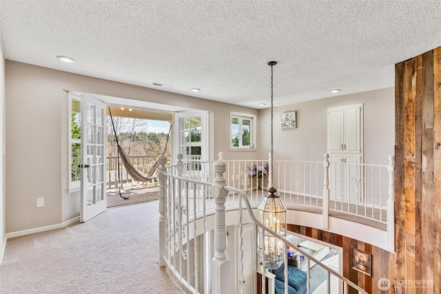 7707 42nd Ave E, Tacoma, WA 98443 - corridor with an upstairs landing, carpet, a textured ceiling, and recessed lighting