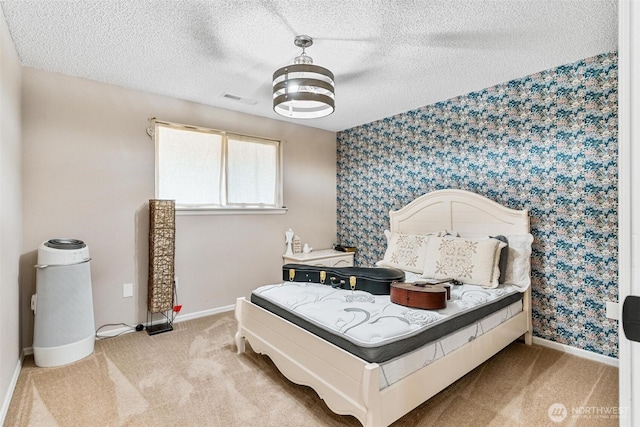 7707 42nd Ave E, Tacoma, WA 98443 - bedroom with wallpapered walls, light carpet, and a textured ceiling