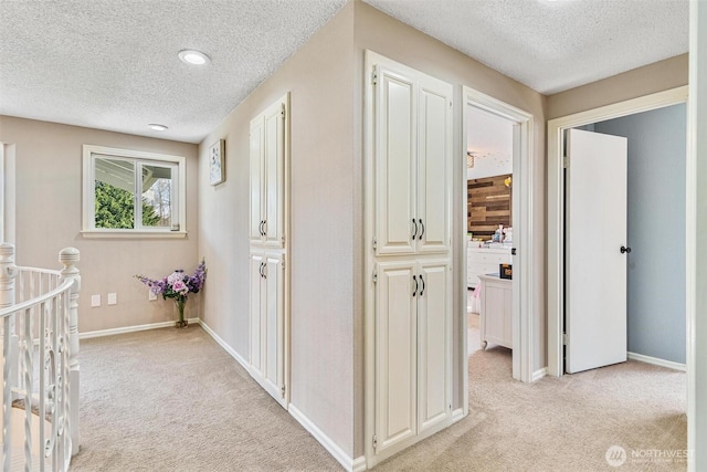7707 42nd Ave E, Tacoma, WA 98443 - corridor featuring light carpet and a textured ceiling