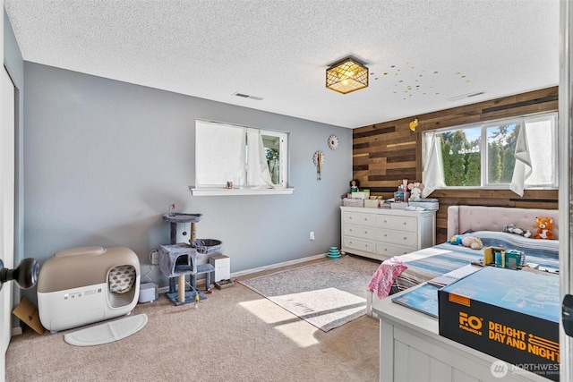 7707 42nd Ave E, Tacoma, WA 98443 - bedroom featuring carpet flooring, a textured ceiling, and wooden walls
