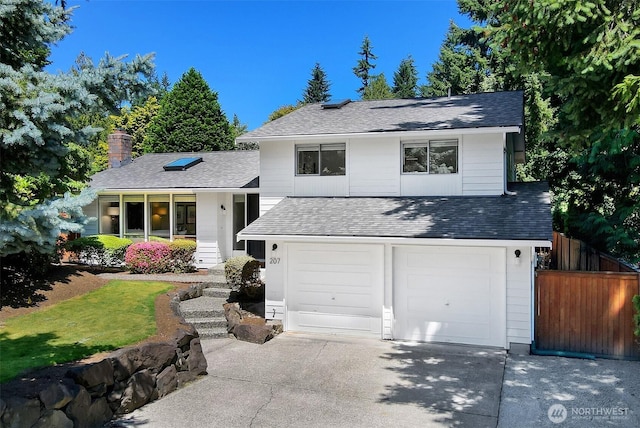207 215th St SE, Bothell, WA 98021 - split level home featuring a chimney, concrete driveway, and roof with shingles