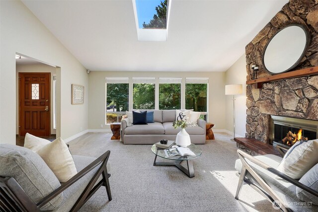 207 215th St SE, Bothell, WA 98021 - living room featuring vaulted ceiling, carpet flooring, a fireplace, and a skylight