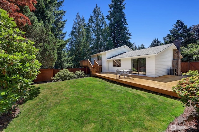 207 215th St SE, Bothell, WA 98021 - back of house with a deck, a chimney, and roof with shingles