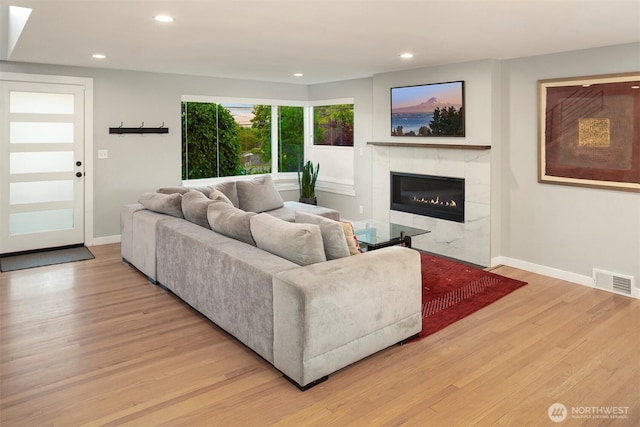 7503 32nd Ave NE, Seattle, WA 98115 - living room with light wood-type flooring, a fireplace, and recessed lighting