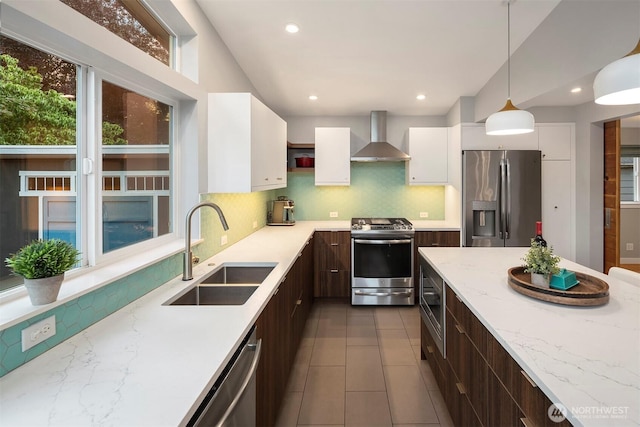 7503 32nd Ave NE, Seattle, WA 98115 - kitchen featuring appliances with stainless steel finishes, wall chimney range hood, dark brown cabinets, white cabinets, and modern cabinets
