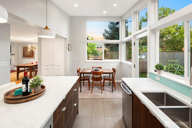 7503 32nd Ave NE, Seattle, WA 98115 - kitchen with modern cabinets, dishwasher, dark brown cabinetry, pendant lighting, and recessed lighting