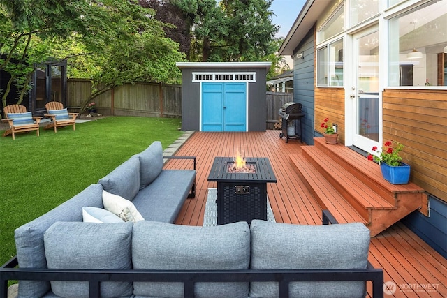 7503 32nd Ave NE, Seattle, WA 98115 - deck featuring a shed, area for grilling, a fenced backyard, and an outdoor living space with a fire pit