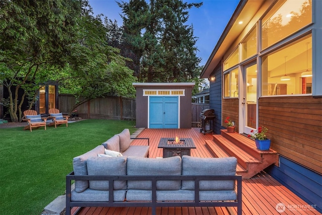 7503 32nd Ave NE, Seattle, WA 98115 - wooden deck featuring a shed, a fenced backyard, an outdoor living space with a fire pit, and a grill