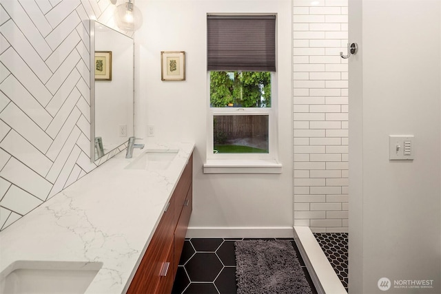 7503 32nd Ave NE, Seattle, WA 98115 - bathroom featuring double vanity, tile patterned flooring, and a tile shower