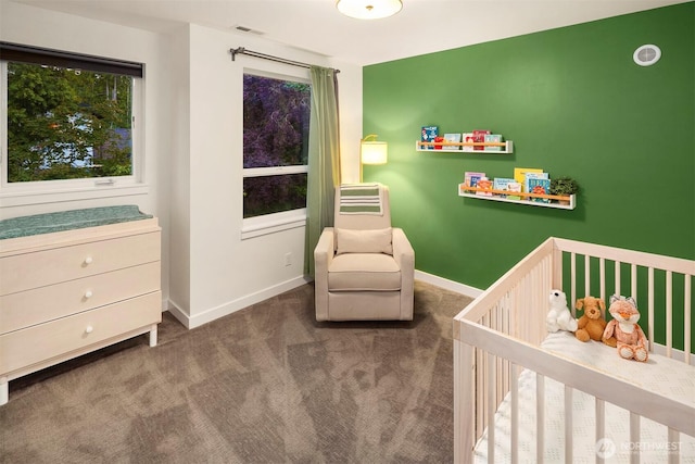 7503 32nd Ave NE, Seattle, WA 98115 - carpeted bedroom with a crib and baseboards