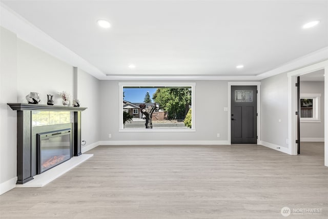 1316 115th St S, Tacoma, WA 98444 - unfurnished living room with light wood-style flooring, recessed lighting, and a glass covered fireplace