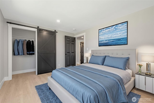 1316 115th St S, Tacoma, WA 98444 - bedroom with light wood-style flooring, a barn door, and recessed lighting