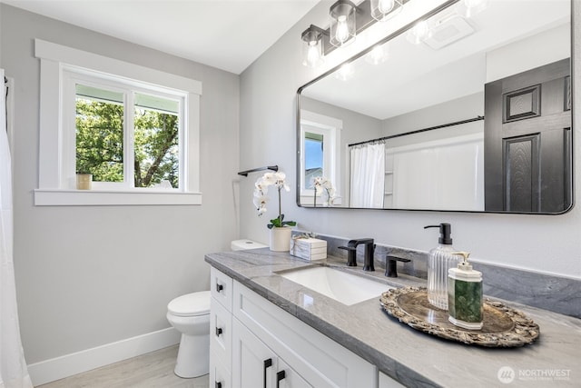 1316 115th St S, Tacoma, WA 98444 - full bathroom featuring vanity, wood finished floors, and a shower with shower curtain