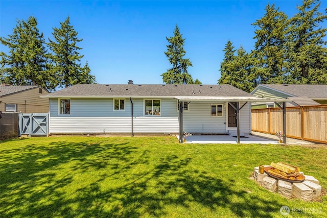 1316 115th St S, Tacoma, WA 98444 - back of house with a fire pit, a patio area, and a fenced backyard