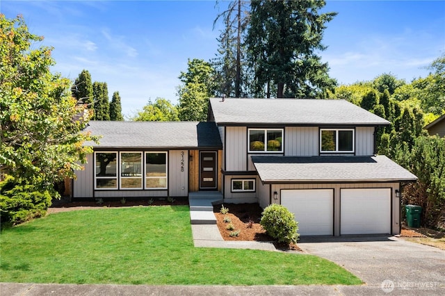 31228 47th Pl SW, Federal Way, WA 98023 - tri-level home with asphalt driveway, a garage, a front yard, and a shingled roof