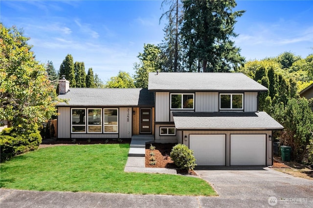31228 47th Pl SW, Federal Way, WA 98023 - tri-level home featuring an attached garage, driveway, a front yard, a chimney, and roof with shingles