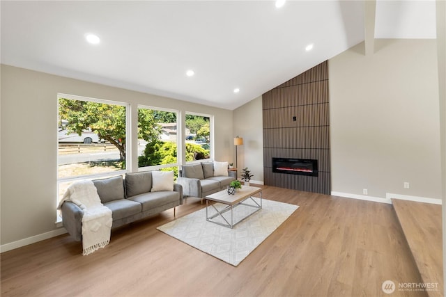 31228 47th Pl SW, Federal Way, WA 98023 - living area featuring light wood finished floors, a large fireplace, recessed lighting, beamed ceiling, and high vaulted ceiling