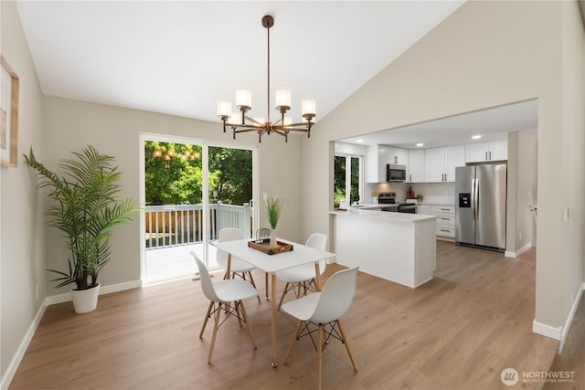 31228 47th Pl SW, Federal Way, WA 98023 - dining space featuring a chandelier, light wood-type flooring, and lofted ceiling