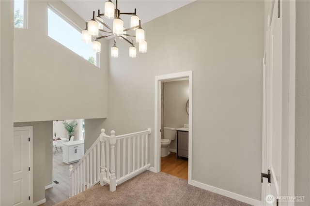 31228 47th Pl SW, Federal Way, WA 98023 - stairway with a towering ceiling, a chandelier, and carpet