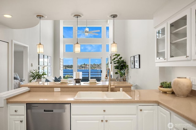 2400 8th Ave N Unit 2, Seattle, WA 98109 - kitchen featuring stainless steel dishwasher, a ceiling fan, glass insert cabinets, white cabinetry, and a water view