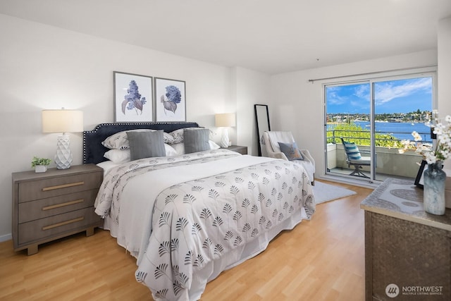 2400 8th Ave N Unit 2, Seattle, WA 98109 - bedroom with light wood-type flooring, access to outside, and a water view