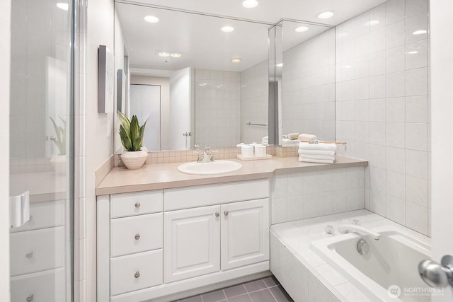 2400 8th Ave N Unit 2, Seattle, WA 98109 - bathroom featuring vanity, a garden tub, tile patterned flooring, and recessed lighting
