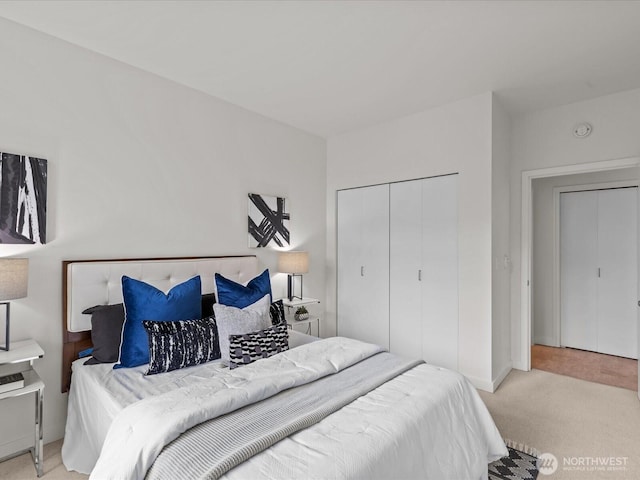2415 2nd Ave Unit 541, Seattle, WA 98121 - carpeted bedroom featuring a closet and baseboards