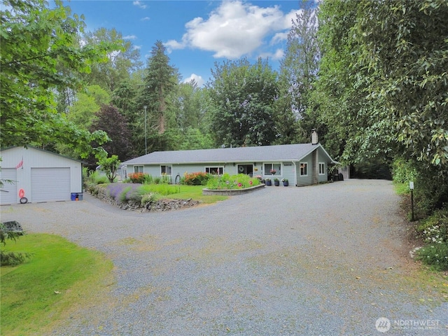 6808 243rd Ave E, Buckley, WA 98321 - single story home with driveway, a chimney, an outdoor structure, and a detached garage