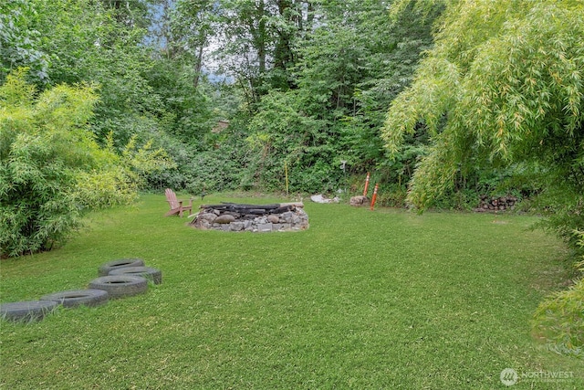6808 243rd Ave E, Buckley, WA 98321 - view of green lawn featuring a fire pit