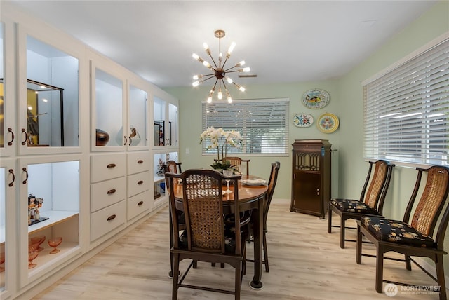 6808 243rd Ave E, Buckley, WA 98321 - dining space featuring a chandelier, healthy amount of natural light, and light wood-style flooring
