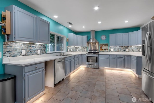 6808 243rd Ave E, Buckley, WA 98321 - kitchen featuring stainless steel appliances, wall chimney range hood, backsplash, light countertops, and recessed lighting