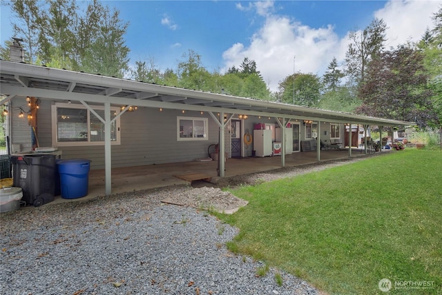 6808 243rd Ave E, Buckley, WA 98321 - back of house featuring a lawn, a chimney, and a patio area