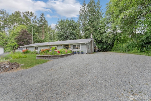 6808 243rd Ave E, Buckley, WA 98321 - ranch-style home with gravel driveway and a chimney