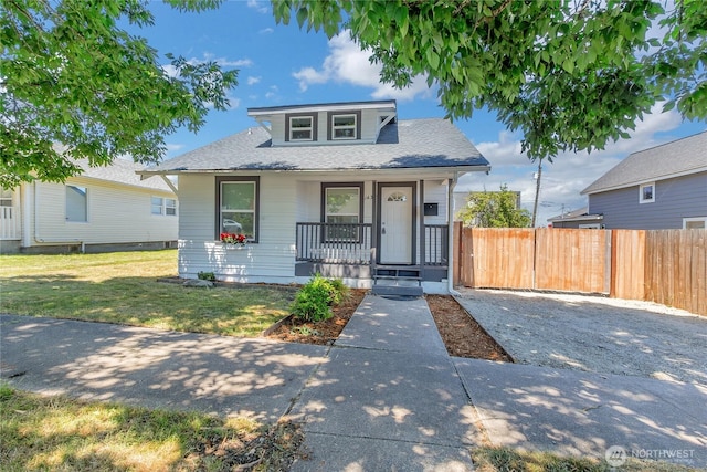 1433 E 32nd St, Tacoma, WA 98404 - bungalow featuring covered porch and roof with shingles