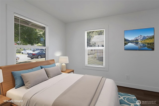 1433 E 32nd St, Tacoma, WA 98404 - bedroom with multiple windows and wood finished floors